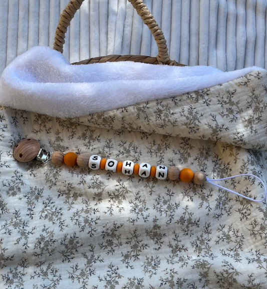 Attache tétine en bois et silicone orange